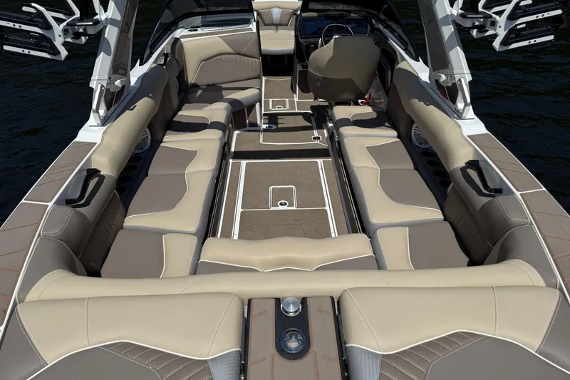 Slide: The Image of 2023 Centurion Fi25 boat interior with beige seating and modern design. - 16