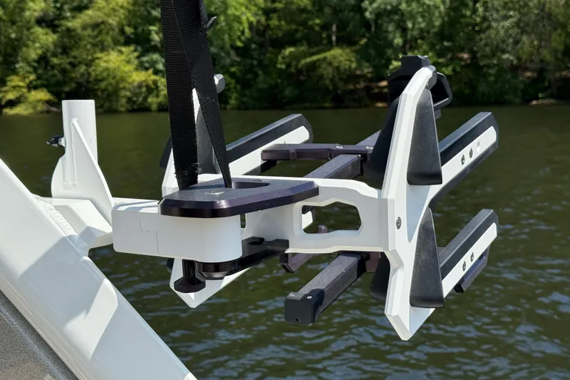 Slide: The Image of 2023 Centurion Fi25 boat accessory on a lake with lush greenery. - 17