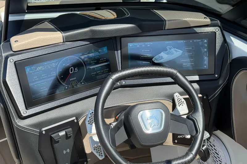 Slide: The Image of 2023 Centurion Fi25 dashboard with dual touchscreens and steering wheel, showcasing advanced controls. - 18
