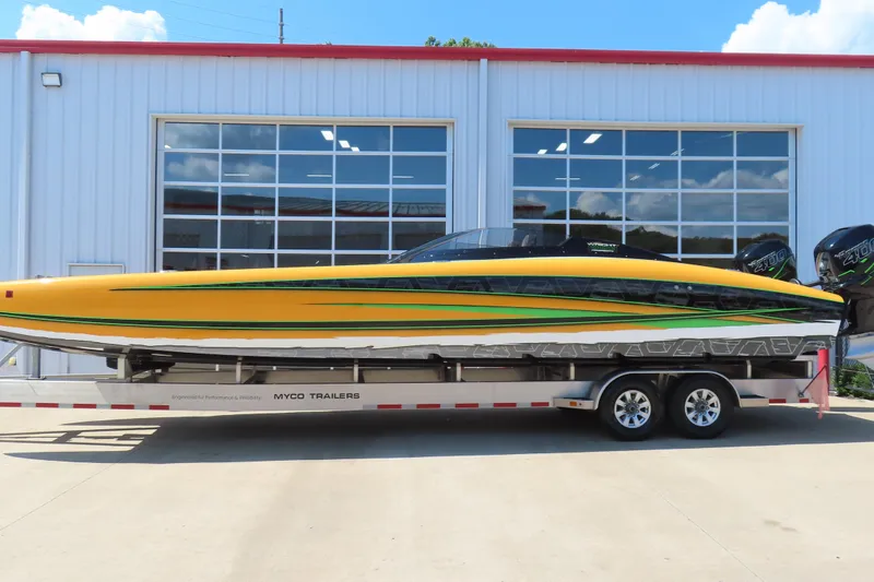 Slide: The Image of 2019 Wright Performance WP 360 boat on trailer, vibrant yellow and green design. - 23