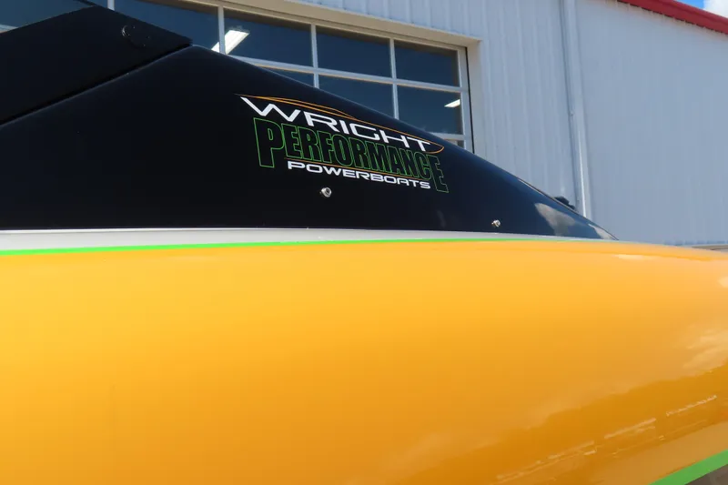 Slide: The Image of Yellow Wright Performance WP 360 powerboat, 2019 model, with logo, against a building backdrop. - 8