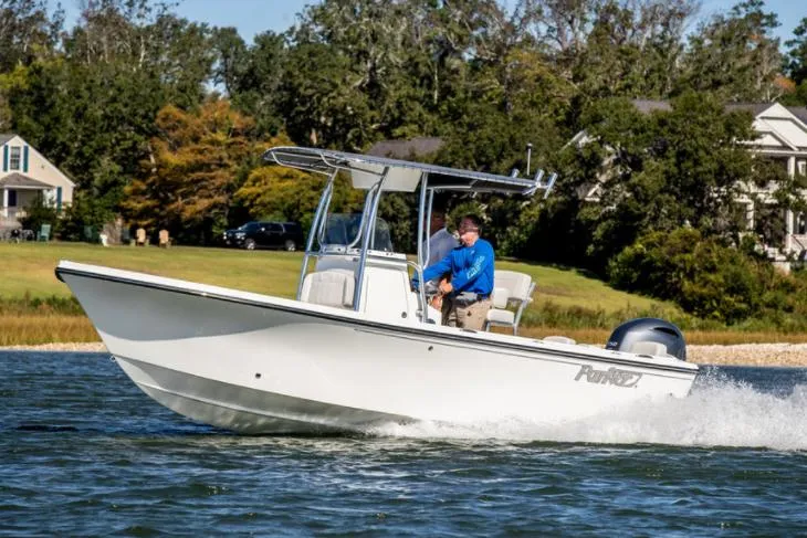 Slide: The Image of Manufacturer Provided Image: 2023 Parker 2100 Special Edition boat cruising on a lake. - 0