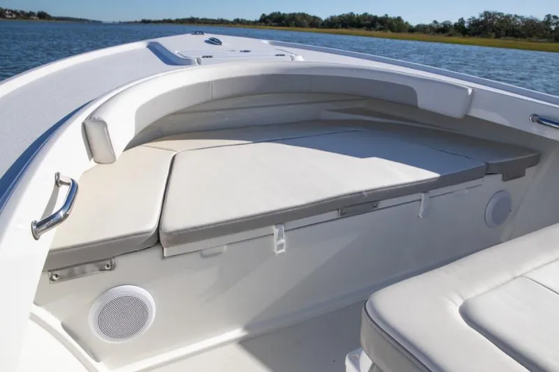 Slide: The Image of Manufacturer Provided Image: 2023 Parker 2100 Special Edition boat interior with cushioned seating and speaker. - 2