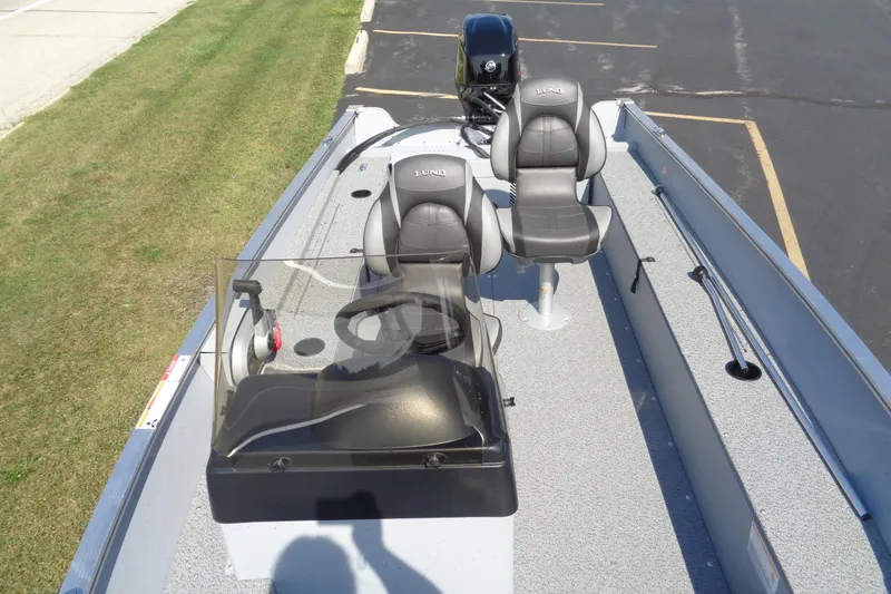 Slide: The Image of 2026 Lund 1600 Fury SS boat interior with two seats and steering console. - 16
