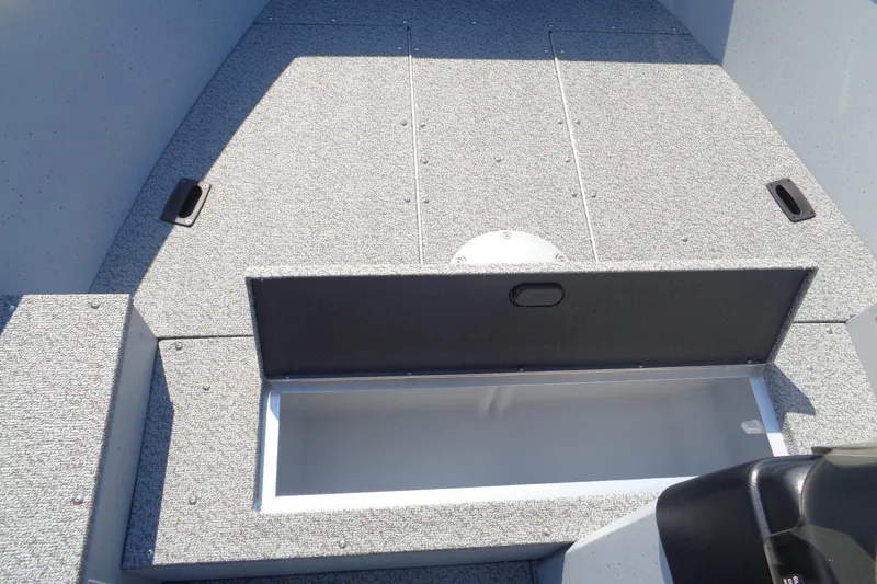 Slide: The Image of 2026 Lund 1600 Fury SS boat interior with open storage compartment. - 18