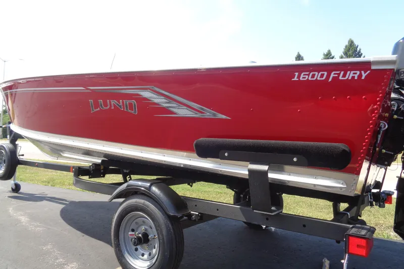 Slide: The Image of Red 2026 Lund 1600 Fury SS boat on trailer, side view. - 3