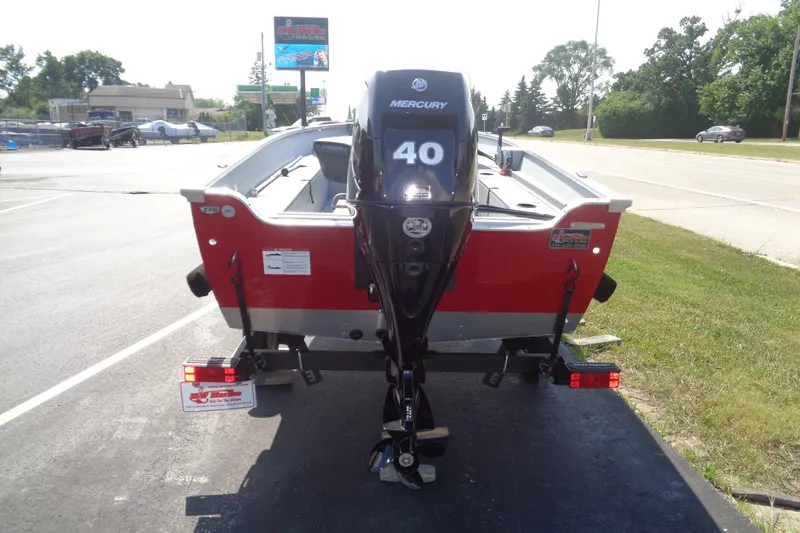 Slide: The Image of 2026 Lund 1600 Fury SS boat with Mercury 40 outboard motor, parked on a trailer. - 5