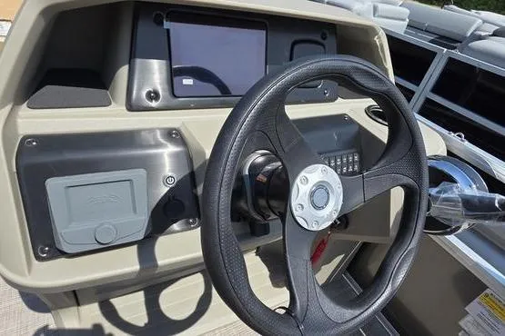 Slide: The Image of Steering console of 2025 Sun Tracker PB 18 DLX pontoon boat with modern controls. - 4