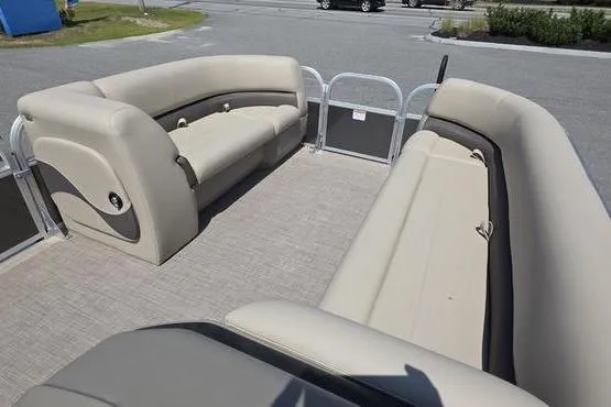 Slide: The Image of 2025 Sun Tracker PB 18 DLX pontoon boat interior with beige seating. - 8