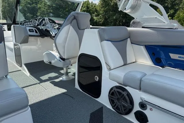 Slide: The Image of 2016 MasterCraft X26 boat interior with modern seating and control panel. - 17