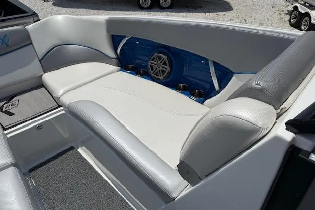 Slide: The Image of 2016 MasterCraft X26 boat interior with white and gray seating. - 21