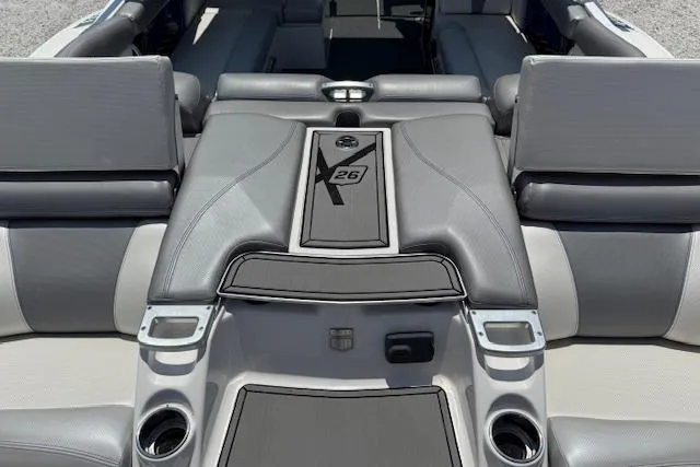 Slide: The Image of 2016 MasterCraft X26 boat interior with sleek gray seating and modern design. - 4