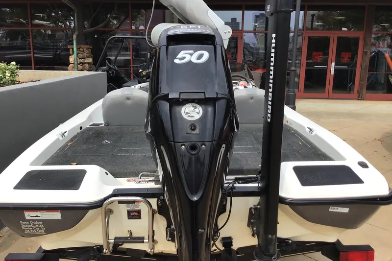 Slide: The Image of 2011 Stratos 176XT boat with outboard motor and Humminbird equipment. - 3