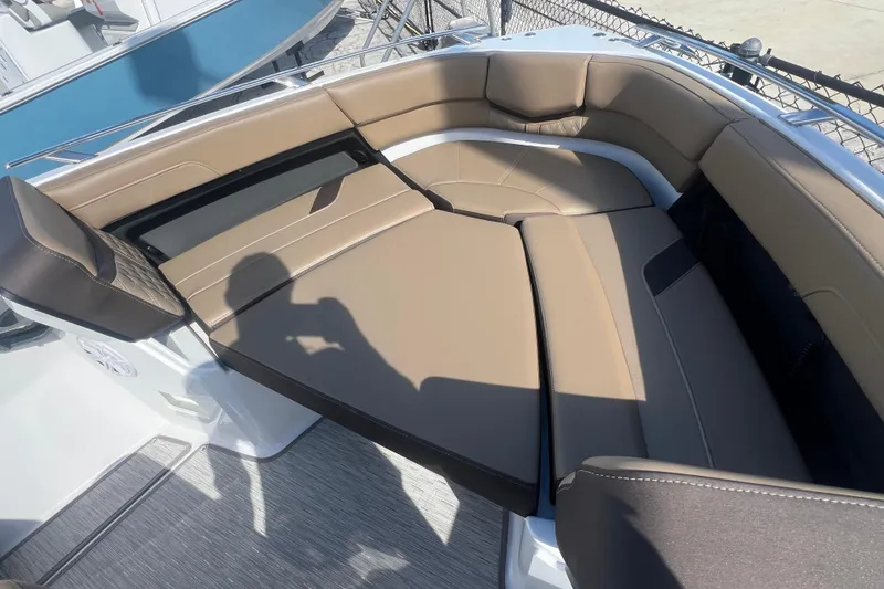 Slide: The Image of 2026 Monterey Elite 27 OB boat interior with tan leather seating. - 13