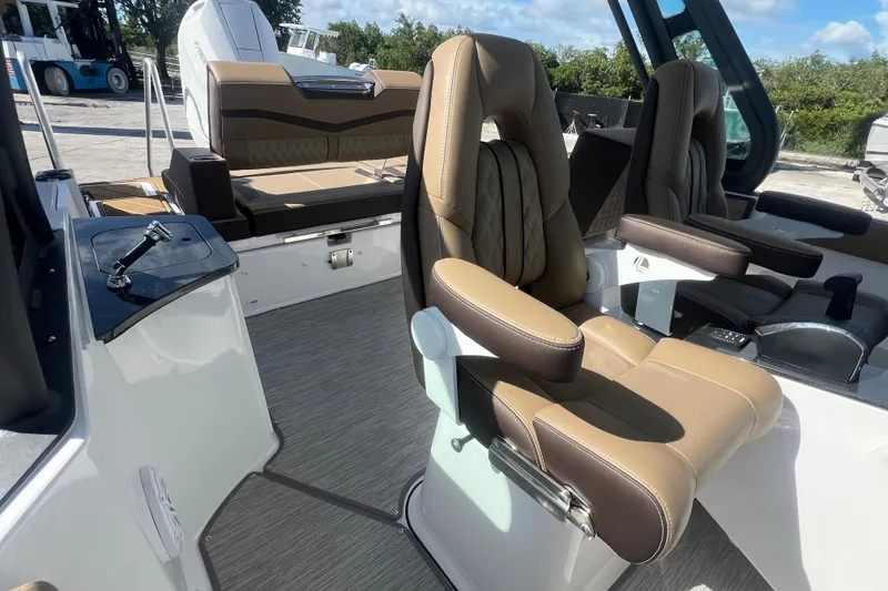 Slide: The Image of 2026 Monterey Elite 27 OB boat interior with luxurious seating and modern design. - 15