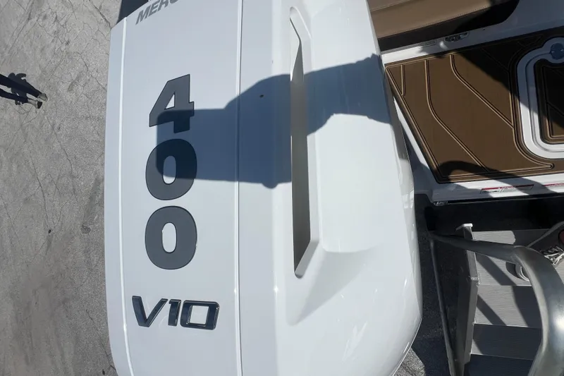 Slide: The Image of 2026 Monterey Elite 27 OB boat with 400 V10 engine, top view. - 3