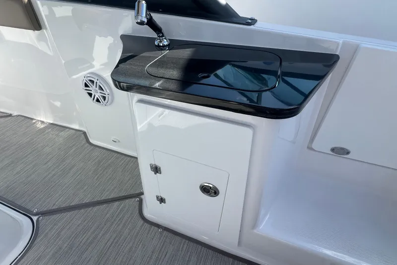 Slide: The Image of Interior of 2026 Monterey Elite 27 OB boat with sleek sink and storage. - 4