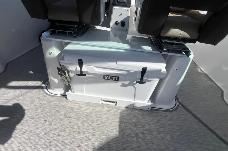 Slide: The Image of 2026 Monterey Elite 27 OB boat interior with Yeti cooler under seats. - 5