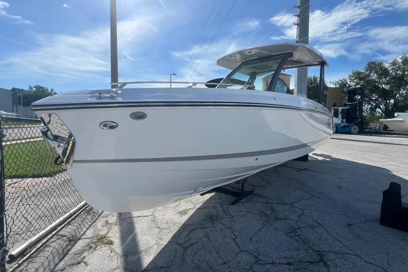 Slide: The Image of 2026 Monterey Elite 27 OB boat in a sunny outdoor setting. - 6