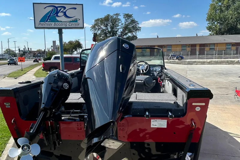 Slide: The Image of 2026 Lund 1875 Tyee boat at Premier Boating Center, featuring powerful outboard motor. - 15