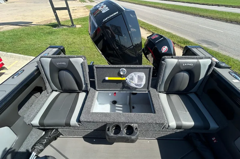 Slide: The Image of 2026 Lund 1875 Tyee boat interior with seating and Mercury outboard motor. - 27