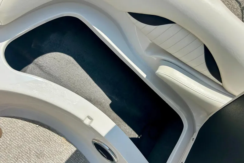 Slide: The Image of 2009 Starcraft Star Step boat interior with white seating and carpeted flooring. - 11