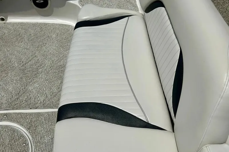 Slide: The Image of 2009 Starcraft Star Step boat seat with white and black upholstery. - 12