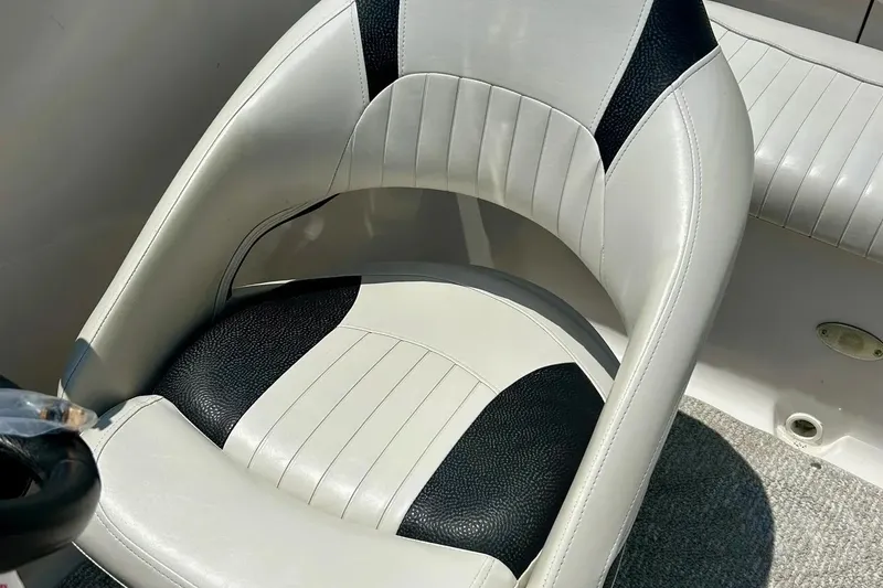 Slide: The Image of 2009 Starcraft Star Step boat seat with black and white upholstery. - 14