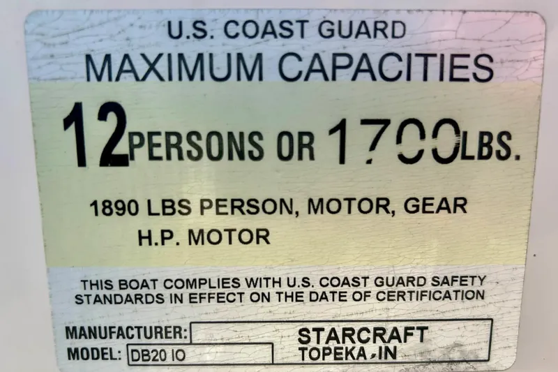 Slide: The Image of 2009 Starcraft Star Step capacity label, 12 persons or 1700 lbs, U.S. Coast Guard compliant. - 16