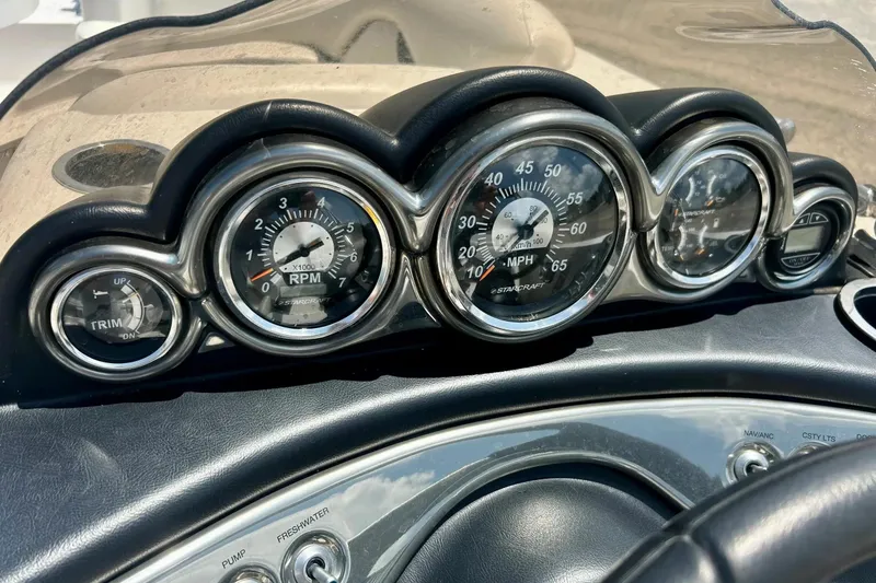Slide: The Image of Dashboard of a 2009 Starcraft Star Step boat with gauges and controls. - 18