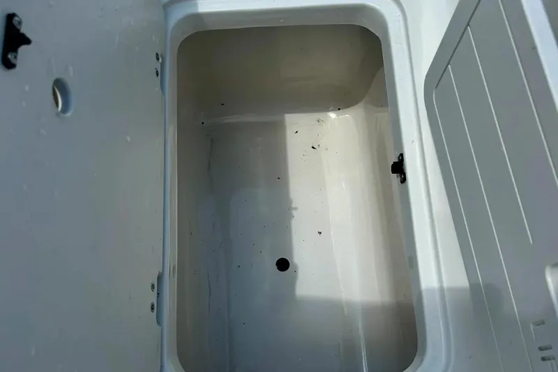 Slide: The Image of 2009 Starcraft Star Step boat storage compartment, open and empty. - 28