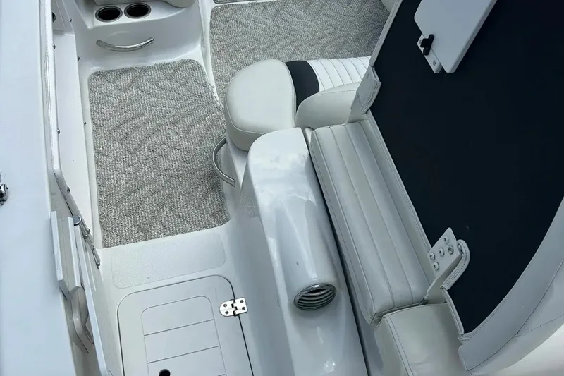 Slide: The Image of 2009 Starcraft Star Step boat interior with white seating and gray carpet. - 31