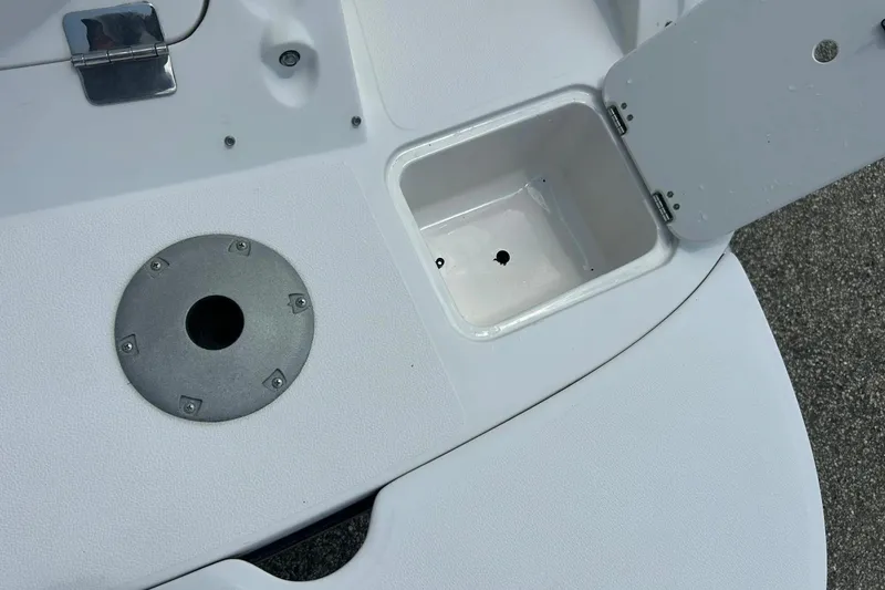 Slide: The Image of 2009 Starcraft Star Step boat deck with storage compartment and metal fixture. - 33