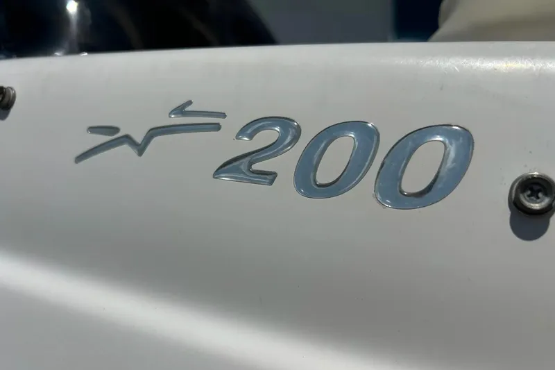 Slide: The Image of Close-up of 2009 Starcraft Star Step 200 emblem on white surface. - 4