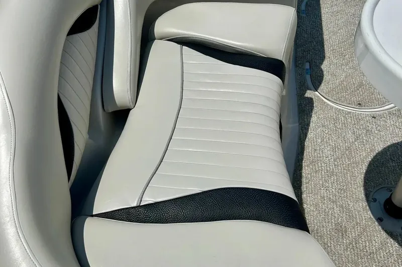 Slide: The Image of 2009 Starcraft Star Step boat interior with white and black seating. - 9