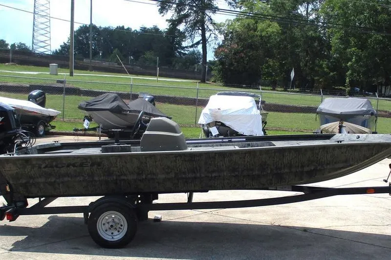 Slide: The Image of 2026 Tracker GRIZZLY® 1648 SC boat on trailer, parked outdoors. - 4