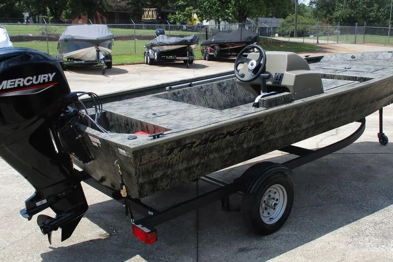 Slide: The Image of 2026 Tracker GRIZZLY® 1648 SC boat with Mercury engine on trailer. - 5