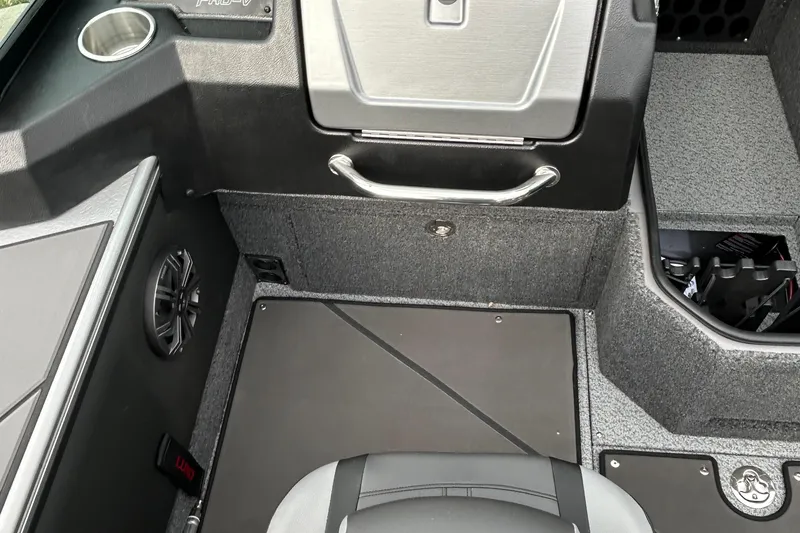 Slide: The Image of Interior of 2026 Lund 1875 Pro-V boat, featuring seating and storage compartments. - 17