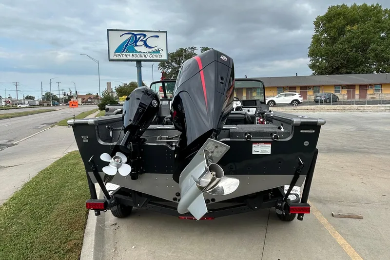 Slide: The Image of 2026 Lund 1875 Pro-V boat at Premier Boating Center, featuring dual outboard motors. - 3