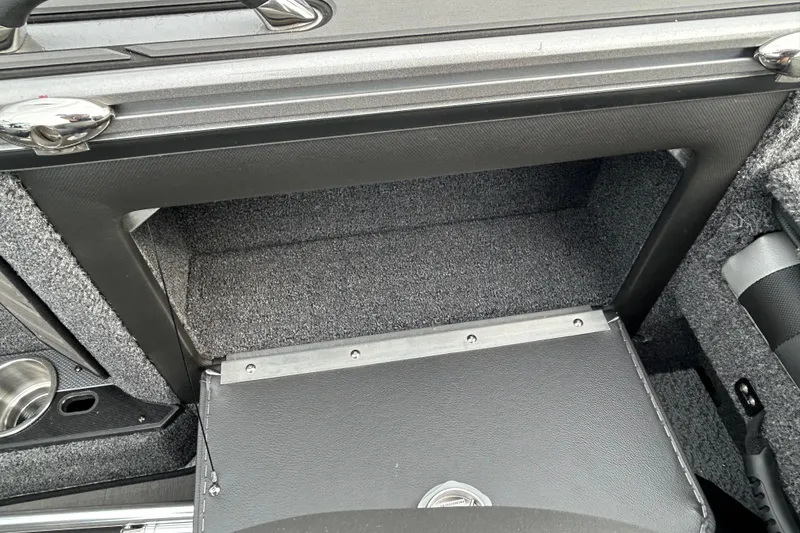 Slide: The Image of Interior storage compartment of 2026 Lund 1875 Pro-V boat, featuring sleek design and durable materials. - 9