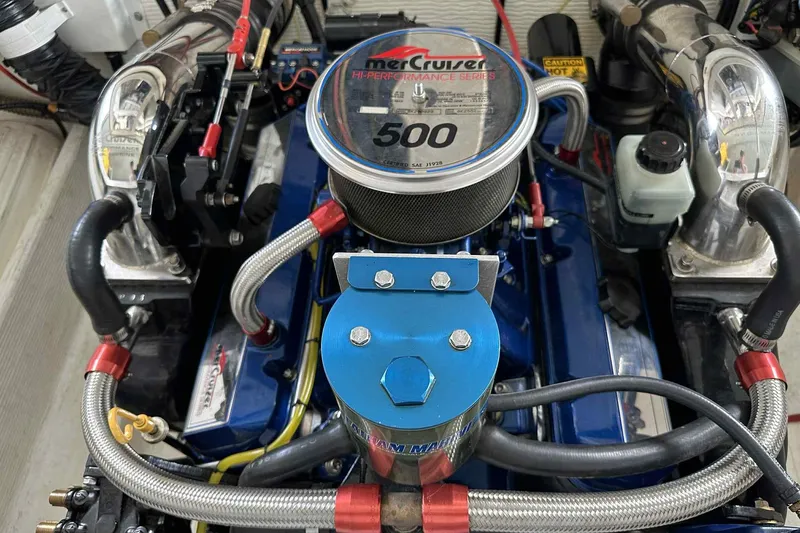 Slide: The Image of High-performance engine of a 1997 Fountain 29 Fever boat, featuring MerCruiser components. - 9