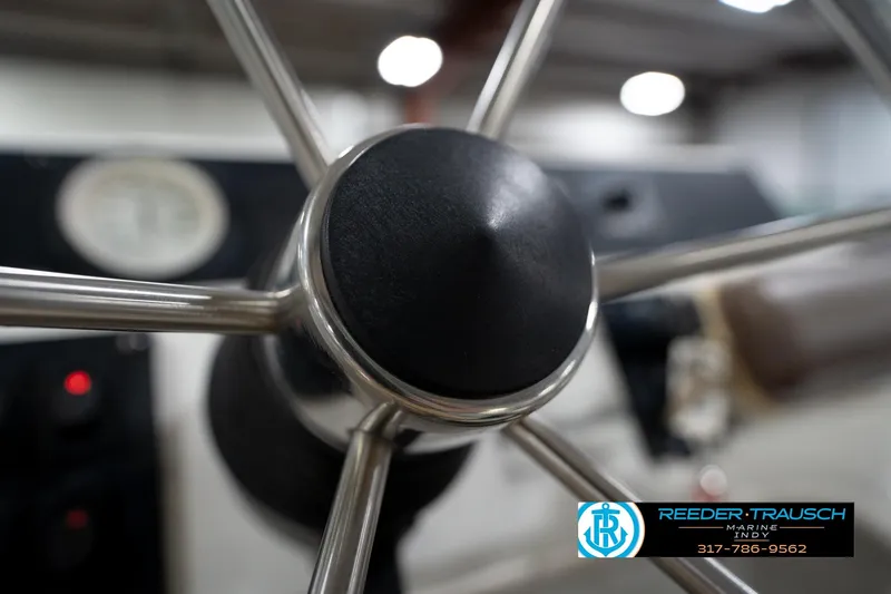 Slide: The Image of Close-up of a Godfrey SP2200 steering wheel, 1991 model, with Reeder Trausch Marine logo. - 31