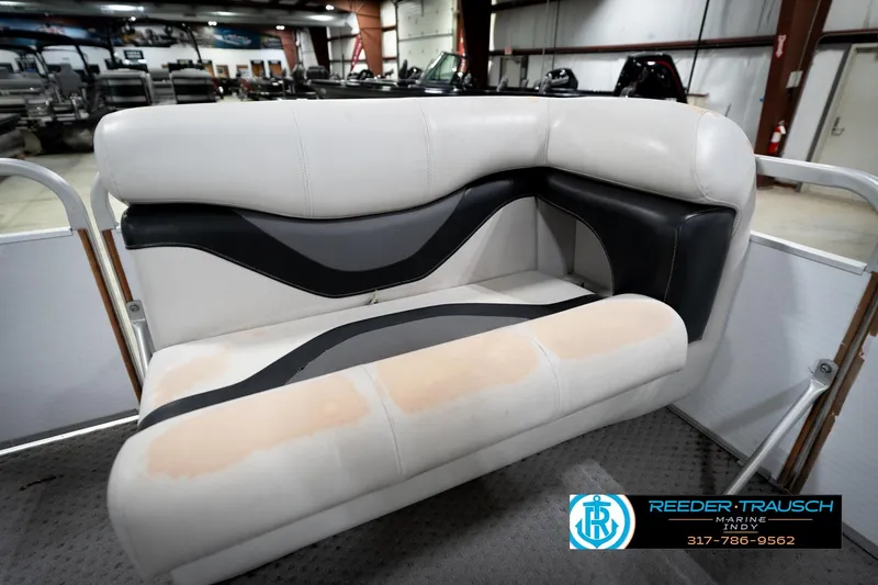 Slide: The Image of White and black boat seat in a showroom, Godfrey SP2200, 1991 model. - 42