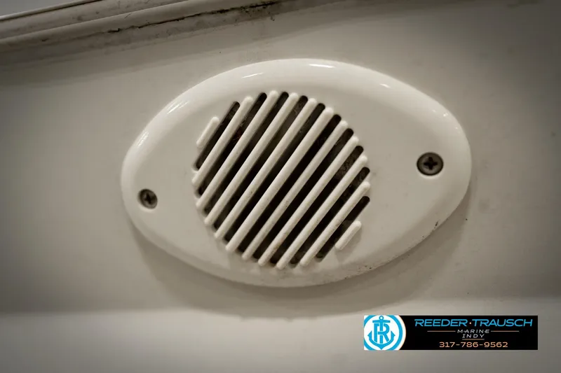 Slide: The Image of White speaker grill on a 1991 Godfrey SP2200 boat, Reeder-Trausch Marine logo visible. - 44