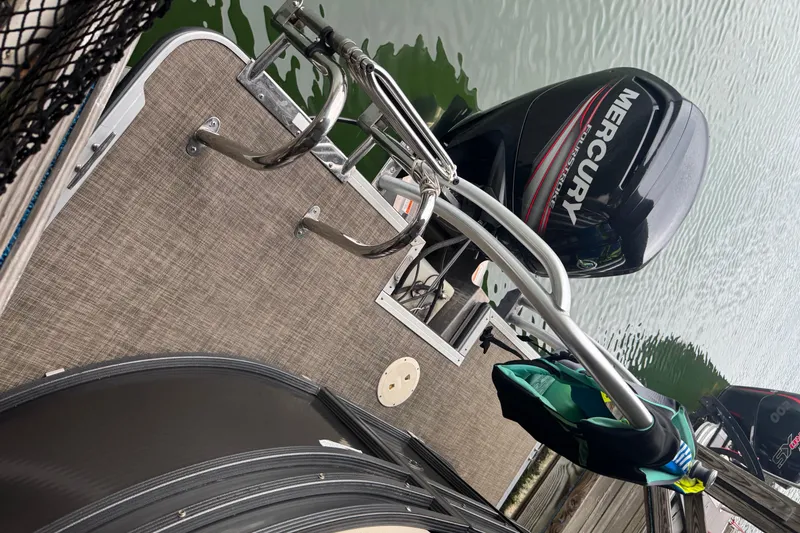 Slide: The Image of 2015 Crest III boat with Mercury outboard motor, docked on calm water. - 4