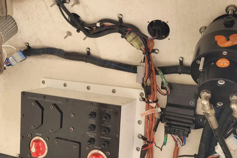 Slide: The Image of Electrical wiring and components inside a 2022 Aquasport 2100 Center Console boat. - 24
