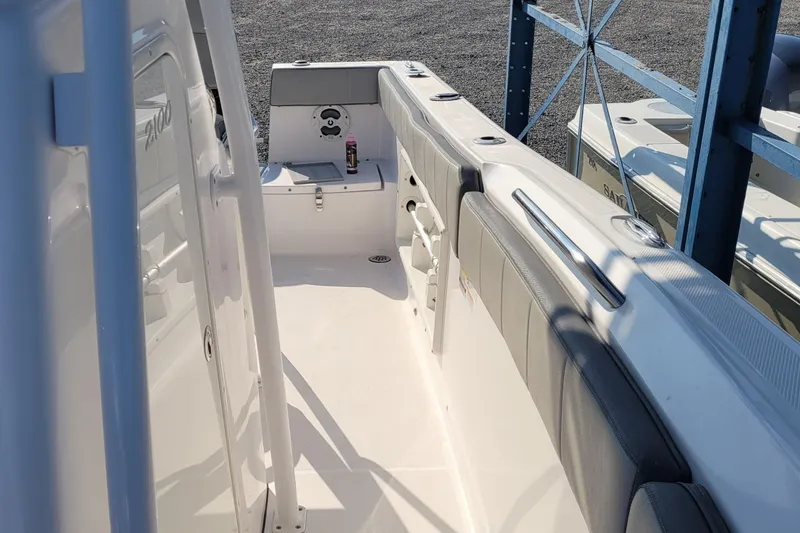 Slide: The Image of 2022 Aquasport 2100 Center Console boat interior with seating and storage. - 27