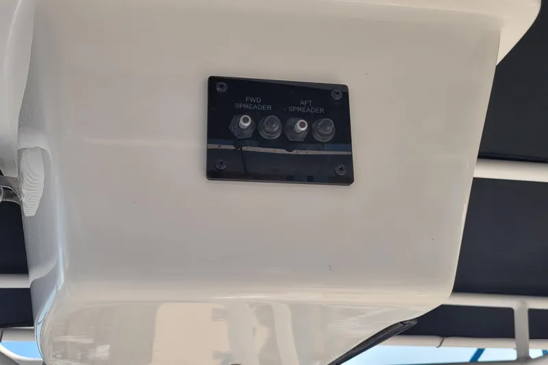 Slide: The Image of 2022 Aquasport 2100 Center Console switch panel for forward and aft spreader lights. - 28