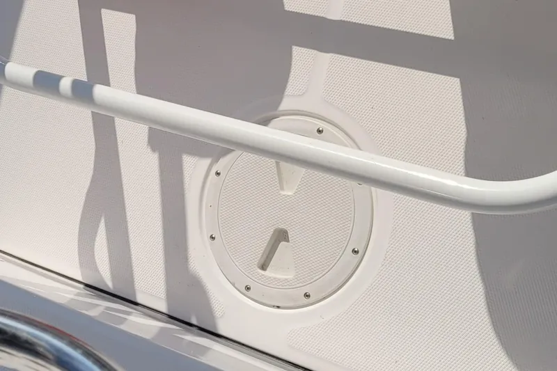 Slide: The Image of 2022 Aquasport 2100 Center Console boat deck with circular hatch detail. - 30