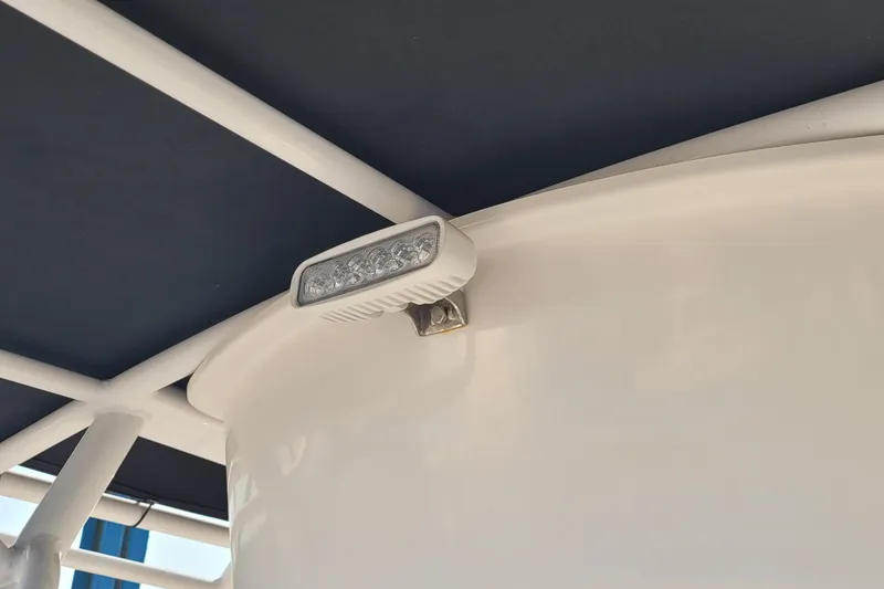 Slide: The Image of LED light on 2022 Aquasport 2100 Center Console boat's T-top structure. - 35